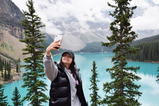 woman taking selfie in mountains